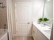 Well-lit bathroom featuring double sinks, a shower with a neutral color scheme offering a calming experience at 3864 Bluethread Way, Poinciana, FL 34759