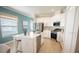 Modern kitchen with white cabinetry, stainless steel appliances, and quartz countertops at 3864 Bluethread Way, Kissimmee, FL 34759