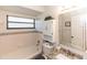 Well-lit bathroom featuring tiled walls, granite vanity, and shower/tub combo at 418 S Summerlin Ave, Sanford, FL 32771