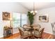 Cozy dining area features a glass top table, seating for four, and a chandelier at 418 S Summerlin Ave, Sanford, FL 32771