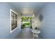 Entrance featuring tiled floors, a decorative wall piece, and a charming seating area at 418 S Summerlin Ave, Sanford, FL 32771