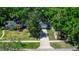 Aerial view of the house showing the property's layout and the surrounding lush greenery and landscaping at 418 S Summerlin Ave, Sanford, FL 32771