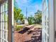 View of the backyard showing a picnic table and bench through glass patio doors at 434 E Harding St, Orlando, FL 32806
