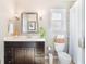 Bathroom with vanity, framed mirror, and neutral color palette at 434 E Harding St, Orlando, FL 32806