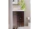 Bathroom vanity with dark wood cabinets, white countertop, and decorative accents at 434 E Harding St, Orlando, FL 32806