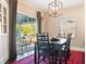 Traditional dining room with large windows and outdoor views at 434 E Harding St, Orlando, FL 32806