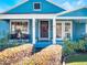 Inviting front porch with stylish seating, decorative wreath, and manicured landscaping at 434 E Harding St, Orlando, FL 32806