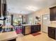Modern kitchen with stainless steel appliances and dark wood cabinetry at 434 E Harding St, Orlando, FL 32806