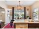 Bright kitchen and dining area with large window and modern light fixture at 434 E Harding St, Orlando, FL 32806