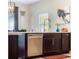 Kitchen island with stainless steel dishwasher and modern faucet at 434 E Harding St, Orlando, FL 32806