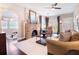 Cozy living room featuring a brick fireplace, dark wood floors, and a comfortable seating area at 434 E Harding St, Orlando, FL 32806