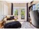 Comfortable office space with a plush chair, shelving, and a patio door leading outside at 434 E Harding St, Orlando, FL 32806