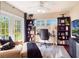 Cozy home office with natural light, desk, shelves, and comfortable seating at 434 E Harding St, Orlando, FL 32806