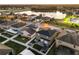 Aerial view of the home shows the fenced in yard, pergola, patio, landscaping, and community at 5278 Walnut Ridge Dr, Orlando, FL 32829