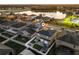 Aerial view of backyard and community features fenced yard, fire pit, and lake views at 5278 Walnut Ridge Dr, Orlando, FL 32829