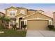 Beautiful two-story home with a well-manicured lawn and a two car garage, creating curb appeal at 5278 Walnut Ridge Dr, Orlando, FL 32829