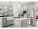 Bright kitchen featuring gray cabinets, stainless steel appliances, and island with quartz countertops at 5278 Walnut Ridge Dr, Orlando, FL 32829