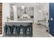 Beautiful kitchen featuring a breakfast bar, stainless steel appliances, pendant lighting, and a dining area at 5278 Walnut Ridge Dr, Orlando, FL 32829