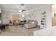 Spacious living room featuring a comfortable sofa, fan, and decoratively adorned with wall art at 5278 Walnut Ridge Dr, Orlando, FL 32829