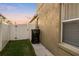Side yard of the home featuring white fencing and landscaping at 5278 Walnut Ridge Dr, Orlando, FL 32829