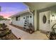 Welcoming entrance with charming plants, a ladder display, and a view of the front door at 53 Fore Dr, New Smyrna Beach, FL 32168