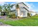 Well-maintained home surrounded by lush landscaping and beautiful trees at 53 Fore Dr, New Smyrna Beach, FL 32168