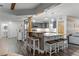Bright kitchen with island seating, stainless appliances, and modern cabinets at 53 Fore Dr, New Smyrna Beach, FL 32168