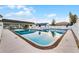 A clear pool with blue accents, surrounded by seating and a well-maintained pool deck at 53 Fore Dr, New Smyrna Beach, FL 32168