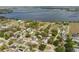 A panoramic aerial view of the houses in the neighborhood with a distant lake at 655 E Lake View Rd, Lake Alfred, FL 33850