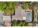 Overhead shot of a property with a pool, patio, and a well-maintained roof, highlighting its layout and features at 655 E Lake View Rd, Lake Alfred, FL 33850