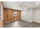 Bedroom featuring wood accent wall, wood-look floors and a ceiling fan and closet at 655 E Lake View Rd, Lake Alfred, FL 33850
