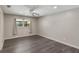 Bright bedroom featuring ceiling fan, and wood-look flooring, with plenty of natural light at 655 E Lake View Rd, Lake Alfred, FL 33850