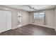 Bedroom showcasing gray flooring, a large closet, and an adjoining bathroom at 655 E Lake View Rd, Lake Alfred, FL 33850