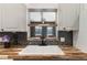 Kitchen pass-through window, wood counters and dark backsplash add character at 655 E Lake View Rd, Lake Alfred, FL 33850