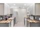 Well-lit kitchen featuring butcher block counters, tiled backsplash, and white appliances and cabinets at 655 E Lake View Rd, Lake Alfred, FL 33850