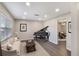 Cozy living room featuring a grand piano, neutral tones, and an inviting atmosphere with an open doorway at 655 E Lake View Rd, Lake Alfred, FL 33850