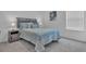Comfortable bedroom featuring a queen-sized bed with plush pillows and plenty of natural light at 7412 Sw 76Th Ter, Ocala, FL 34481