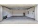 Spacious two-car garage offering ample parking and storage, complete with a modern garage door at 7412 Sw 76Th Ter, Ocala, FL 34481