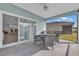 Covered patio with outdoor dining, offering a relaxing space for entertaining or enjoying meals at 7412 Sw 76Th Ter, Ocala, FL 34481