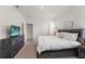The bedroom has carpet, white walls, and access to a bathroom and closet at 7630 Oakmoss Loop, Davenport, FL 33837