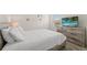 Bright bedroom featuring rustic-style furniture and decor at 7630 Oakmoss Loop, Davenport, FL 33837