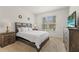 The bedroom has carpet, a beautiful view from the window, and a TV at 7630 Oakmoss Loop, Davenport, FL 33837