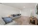 Comfortable living room with a sofa and entertainment center at 7630 Oakmoss Loop, Davenport, FL 33837