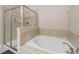 Bathroom featuring a bathtub, shower, and neutral tile surround at 7702 Fairfax Dr, Kissimmee, FL 34747