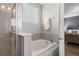 Relaxing bathroom with a soaking tub and separate glass-enclosed shower at 7702 Fairfax Dr, Kissimmee, FL 34747