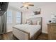 Cozy bedroom showcasing a comfortable bed, soft colors, and ample natural light at 7702 Fairfax Dr, Kissimmee, FL 34747