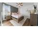 Lovely bedroom with a window providing ample natural light and comfortable design at 7702 Fairfax Dr, Kissimmee, FL 34747
