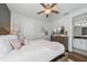 Inviting bedroom provides a calming ambiance with a neutral color scheme and soft textures at 7702 Fairfax Dr, Kissimmee, FL 34747