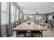 Bright dining area with large table, seating for many, and multiple windows at 7702 Fairfax Dr, Kissimmee, FL 34747