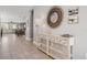Welcoming foyer with tile flooring, a decorative mirror, and a stylish console table at 7702 Fairfax Dr, Kissimmee, FL 34747